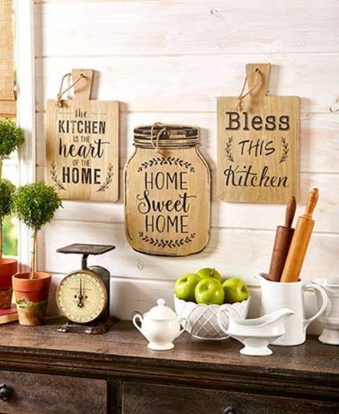 lovely rustic wall decor with cutting boards and a jar with letters is a lovely idea for a farmhouse kitchen