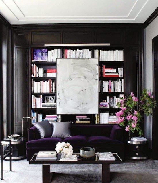33 a refined modern monochromatic living room with built-in bookshelves, a deep purple velvet sofa for a color statement and a chic table