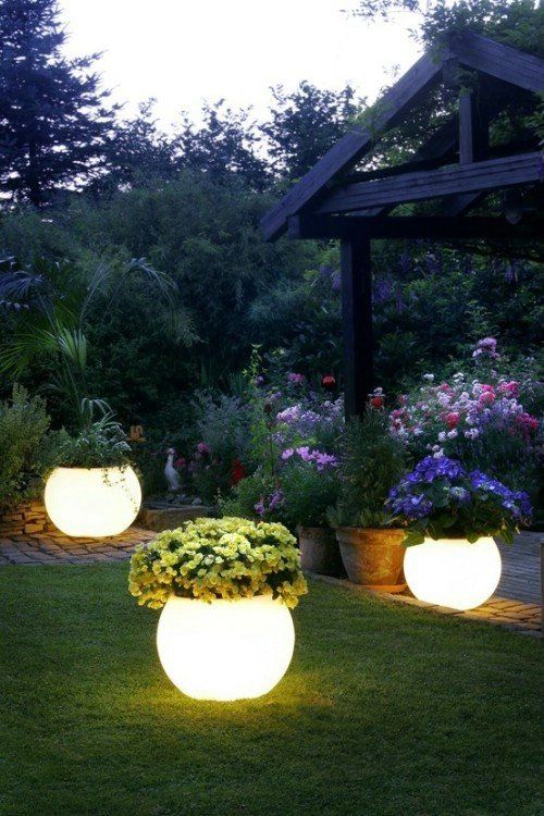 33 lit up planters with blooms are a very creative way to light up your garden and bring a decorative value at the same time