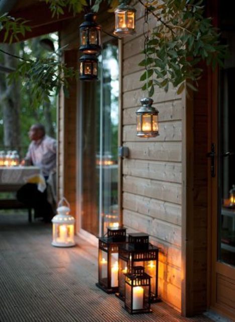 hanging and floor candle lanterns all around will make the space feel very intimate and welcoming