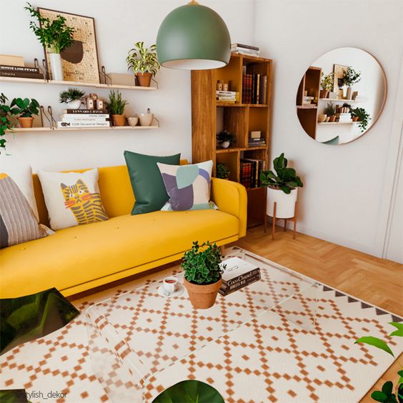 a bold modern living room with a yellow sofa, a bookcase, lots of potted greenery and a geometric print rug