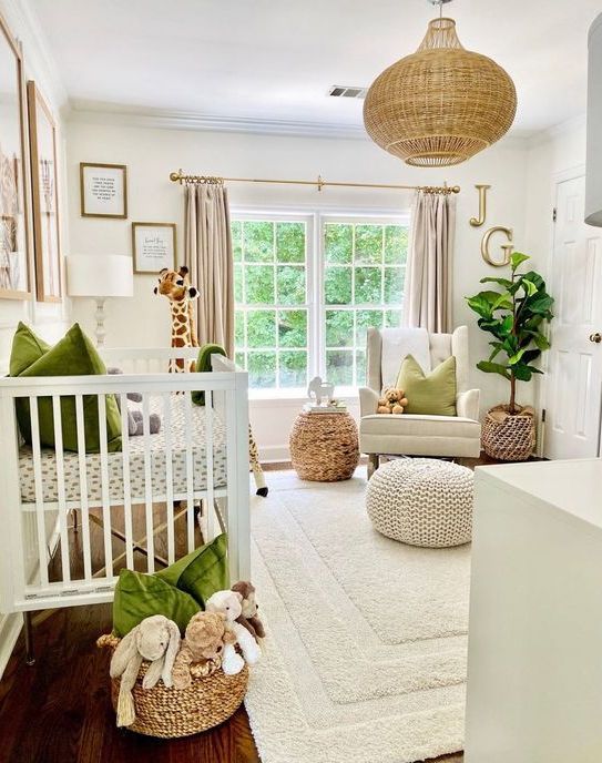 a cozy neutral nursery spruced up with green touches – pillows and blankets, with a woven pendant lamp and baskets for a cozy feel