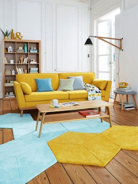 a vibrant living room with a yellow sofa, a geometric blue and yellow rug and stained wooden furniture is cool