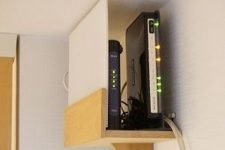 17 a mini shelf attached right under the ceiling will elegantly hide your router and will merge with the color of the walls and ceiling