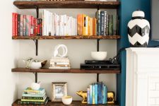 19 a router placed on a shelf makes part of decor like stacked books is a lovely idea to hide it right in the sight