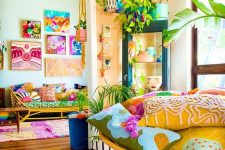 a colorful maximalist space with rattan furniture, colorful accessories and textiles plus bright gallery walls is super fun