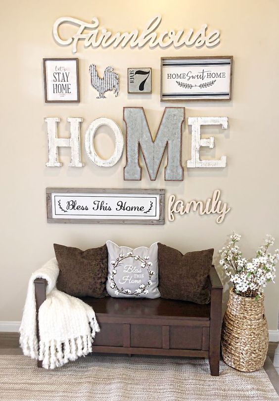 a cool rustic gallery wall with letters, framed signs, silhouettes and numbers is a pretty and cozy idea for an entryway
