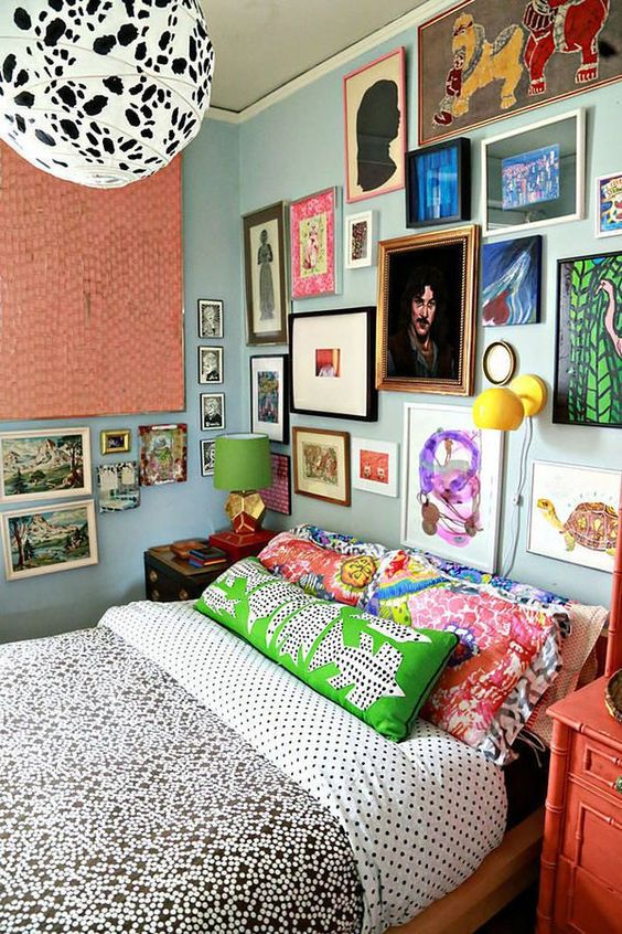 a maxi bedroom with a cool gallery wall