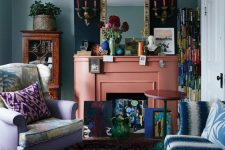 a maximalist living room with green walls, a lilac chair and a blue and white sofa, colorful pillows, a coral fireplace and bright accessories