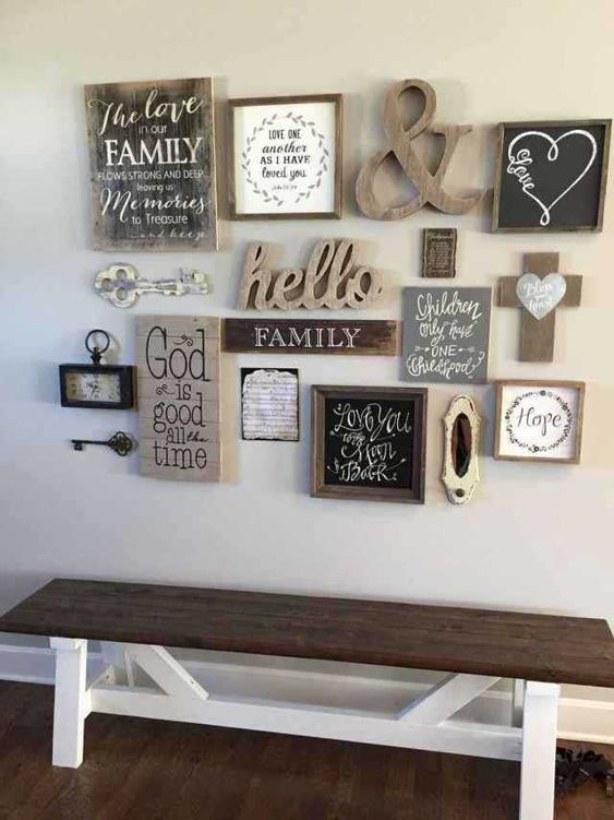 a shabby chic and rustic gallery wall with vintage keys, clocks, signs, an ampersand and chalkboard in a frame is cool