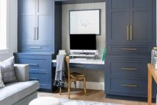 10 a stylish home office done with navy kitchen cabinets, a pastel blue sofa and faux fur stools, gold touches for more elegance