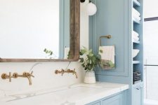 13 a lovely coastal bathroom done with light blue kitchen cabinets and a vanity that matches, with a white stone countertop
