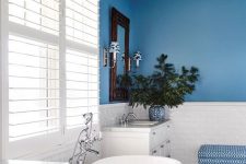 a cool bathroom design with a blue wall