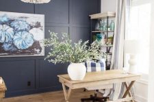 a stylish farmhouse home office with blue tones