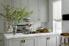 a country kitchen with subway tiles
