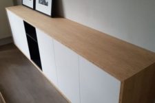 23 a chic contemporary floating credenza of IKEA Metod cabinets and Tutema cabinets plus a light-stained wooden cover