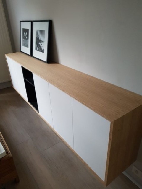 A chic contemporary floating credenza of IKEA Metod cabinets and Tutema cabinets plus a light stained wooden