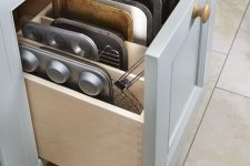 32 a drawer for storing baking trays and other stuff necessary for cooking is a smart idea for a millennial kitchen