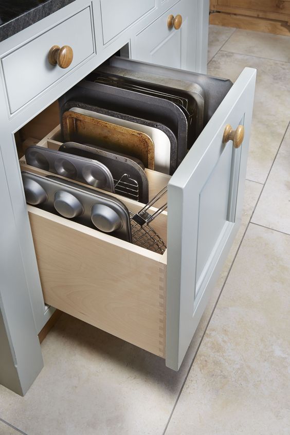 a drawer for storing baking trays and other stuff necessary for cooking is a smart idea for a millennial kitchen