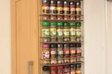 36 a cabinet with a mini spice rack attached to the side will hold a lot of spices easily