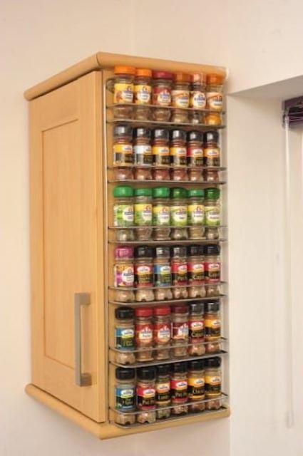 a cabinet with a mini spice rack attached to the side will hold a lot of spices easily