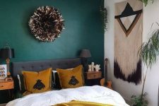 a cozy boho bedroom design with a bold accent wall