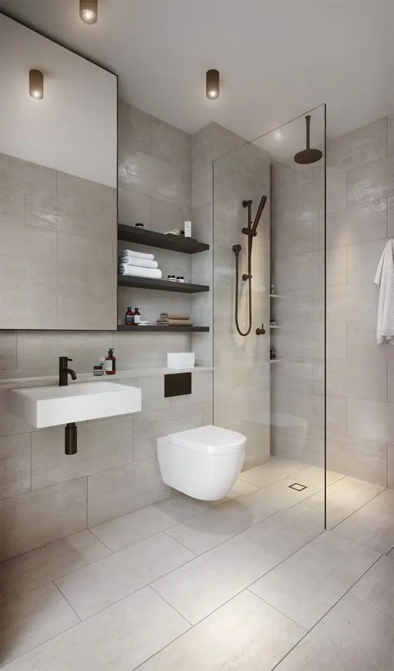 a clean contemporary bathroom clad with neutral tiles, a shower space, a mirror, black shelves and black fixtures