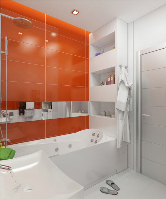 A minimalist bathroom with large scale tiles, an orange accent wall and all white everything is a very bold idea for a contemporary home