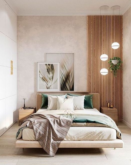 a pretty contemporary bedroom in neutrals, with a wooden slab accent, a floating bed with neutral bedding, a sleek storage unit that takes a whole wall and a cluster of pendant lamps