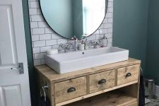 a reclaimed wood bathroom vanity with drawers is a cool idea for a millennial bathroom and it will add a warming touch to the space