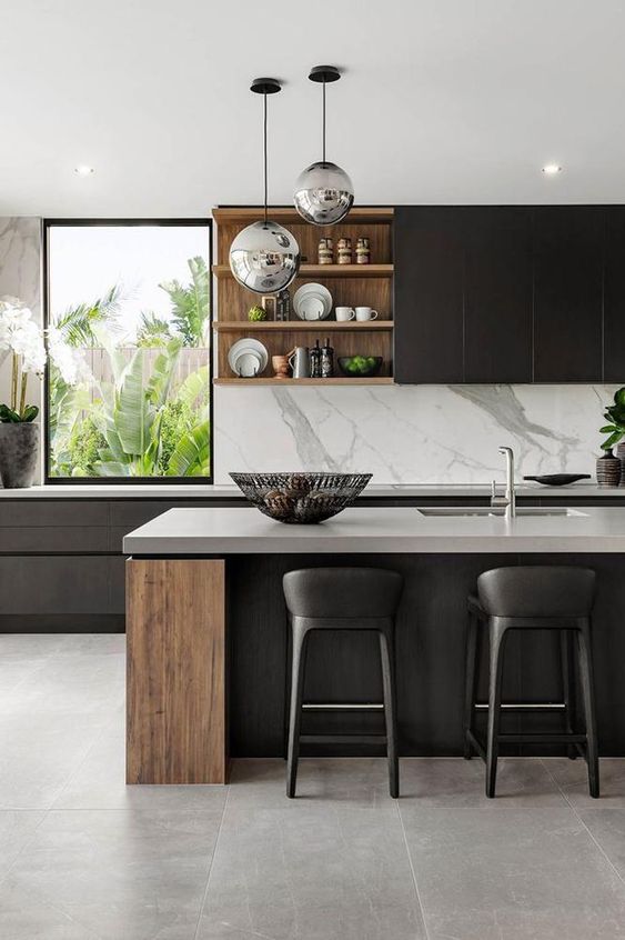 a super refined contemporary kitchen with sleek black cabinets, stained wood elements, white stone coutnertops and a backsplash