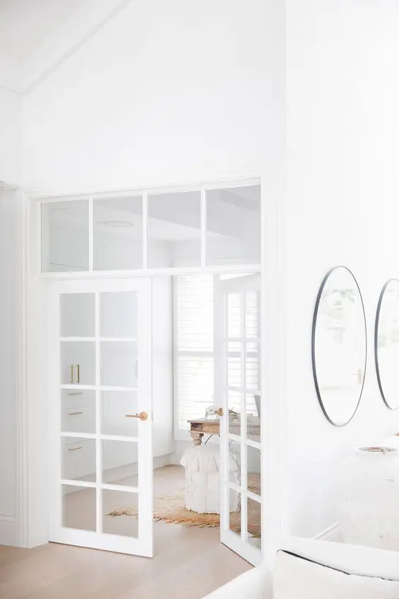 delicate and subtle white French doors will match a neutral space and make the spaces filled with light even more
