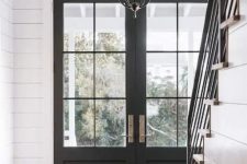 lovely black French doors are an amazing fir for a rustic space and entrance and are timeless and chic, they can fit many other styles, too