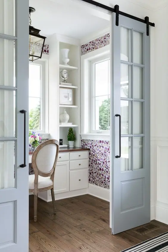 powder blue sliding French doors are a great way to add chic to the interior and save space at the same time