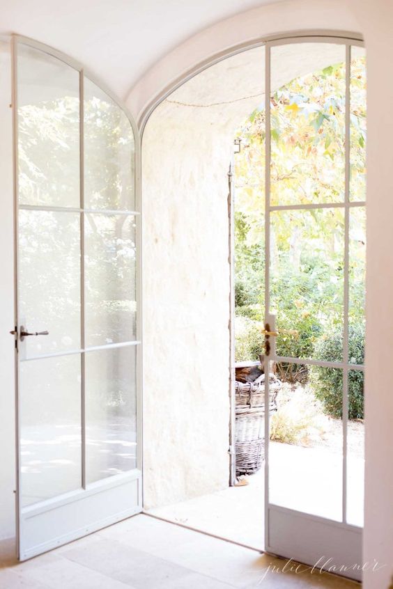 very delicate white arched Frech doors are gorgeous for any space, they look amazing in many areas, both indoors and outdoors