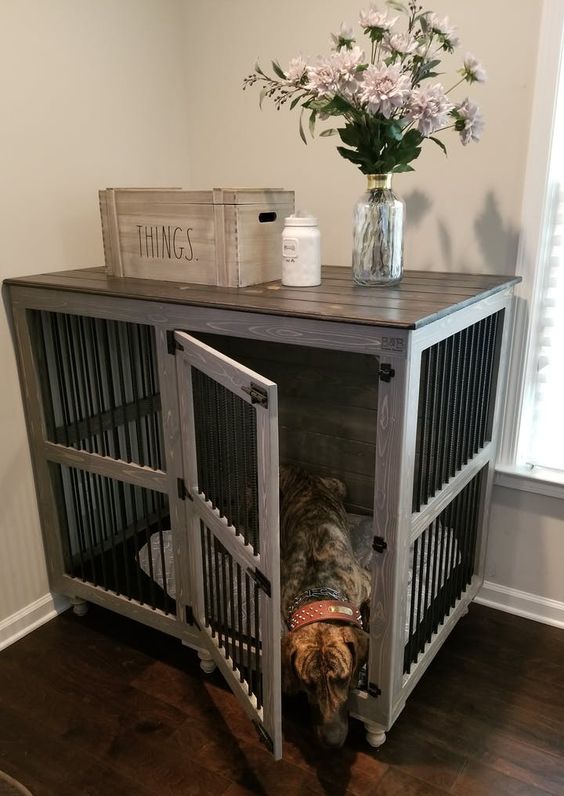 a farmhouse kennel with a dark countertop doubles as a console table and matches a farmhouse space