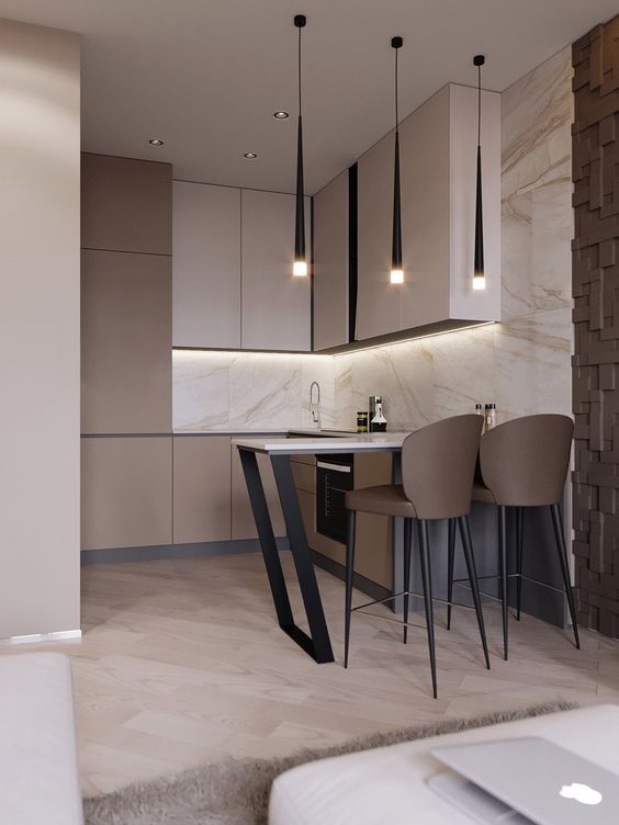 a refined contemporary mini kitchen with tan and taupe sleek cabinets, white stone countertops and a backsplash, a floating countertop for eating