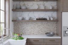 a refined taupe kitchen with a penny tile backsplash, open shelves, white stone countertops and a faceted pendant lamp is chic