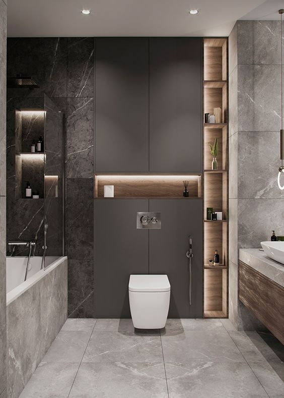 a sophisticated grey bathroom with a taupe sleek panel, built-in lights, white appliances and marble and stone tiles is amazing