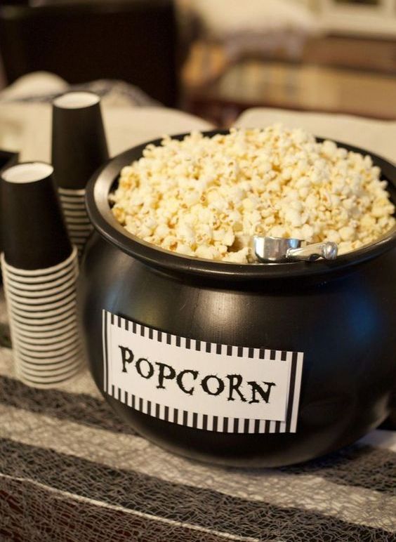 a black cauldron with popcorn is a cool way to serve this treat and it's very Halloween-inspired and cool