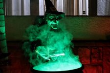 28 a witch cauldron prop wih additional green lights and some lights under it is a cool solution for outdoor Halloween decor