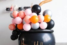 29 a witches’ cauldron filled with colorful balloons is a fun and cool idea to rock at Halloween, will do for both adults’ and kids’ parties
