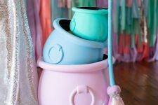 33 pastel-colored cauldrons and a broom fro styling a fun adult or a sweet kids’ Halloween party