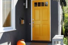 simple pumpkins makes a front porch looks perfect at fall