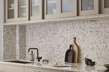 a neutral kitchen design with terrazzo elements