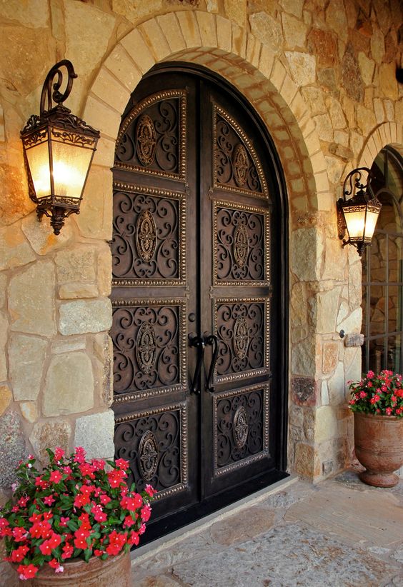 Dark vintage styled wrought iron front doors are perfect for a mansion or a large vintage house as they make a refined statement at once
