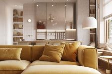 19 a beautiful minimalist space with silver kitchen cabinets and a mustard yellow sectional plus brass touches for elegance