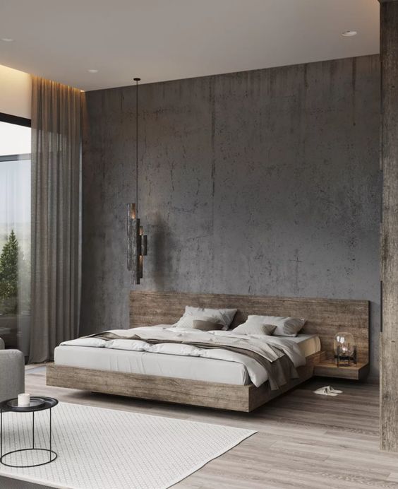 A sophsticated minimalist bedroom with an aged metal accent wall, a light stained floating bed with built in nightstands, neutral bedding and a pendant lamp