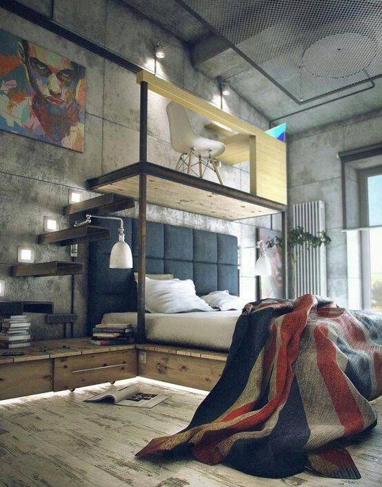 An industrial bedroom with concrete walls and a shabby chic floor, a floating bed with a built in nightstand and a platform on top
