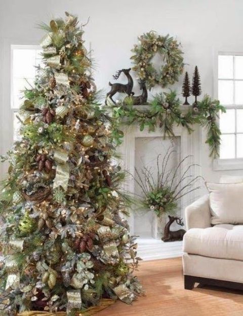 a pretty woodland Christmas tree with pinecones, green ornaments, ribbons, branches and leaves, lights